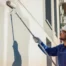 Professional house painters in Annapolis MD painting a residential exterior.